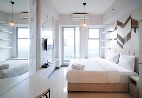 Bedroom Comfy Studio (No Kitchen) at Benson Supermall Mansion Apartment By Travelio