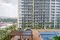 Bangunan Cozy and Homey Studio Room Daan Mogot City Apartment By Travelio
