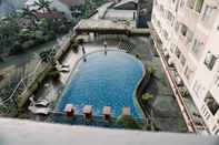 Swimming Pool Comfort and Simply Stay 2BR at Belmont Residence Puri Apartment By Travelio