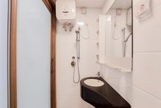 In-room Bathroom Cozy Living Studio Sky House BSD Apartment By Travelio