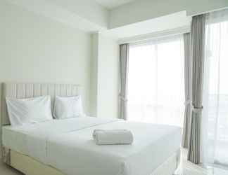 Bedroom 2 Simply Look Studio Apartment at Green Sedayu By Travelio