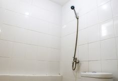 In-room Bathroom 6 Modern and Comfort 2BR at Bassura City Apartment By Travelio
