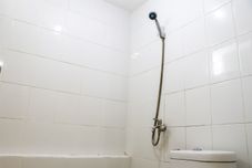 In-room Bathroom Modern and Comfort 2BR at Bassura City Apartment By Travelio
