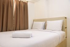 Bedroom Modern and Comfort 2BR at Bassura City Apartment By Travelio