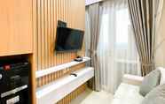 Lobby 3 Minimalist and Homey 1BR Vasanta Innopark Apartment By Travelio