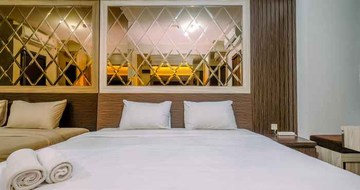 Bedroom Minimalist and Warm Studio Room Transpark Cibubur Apartment By Travelio