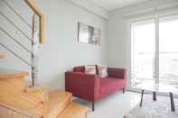 Common Space Spacious and Comfy 2BR Loft Apartment Maqna Residence By Travelio