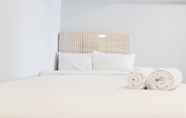 Kamar Tidur 2 Spacious and Comfy 2BR Loft Apartment Maqna Residence By Travelio