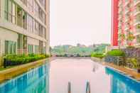 Swimming Pool Cozy and Homey Studio Room Taman Melati Margonda Apartment By Travelio