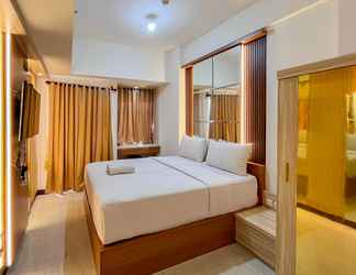 Bedroom 2 Tidy and Pleasurable Studio Vida View Makassar Apartment By Travelio