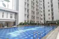 Kolam Renang Homey and Best Choice Studio at Bale Hinggil Apartment By Travelio