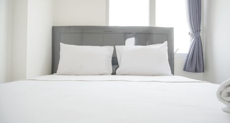 Bedroom 2 Tidy and Nice 2BR at Bassura City Apartment near Mall By Travelio