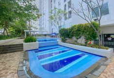 Swimming Pool 7 Tidy and Nice 2BR at Bassura City Apartment near Mall By Travelio