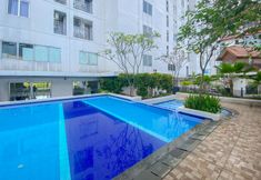 Swimming Pool 6 Tidy and Nice 2BR at Bassura City Apartment near Mall By Travelio
