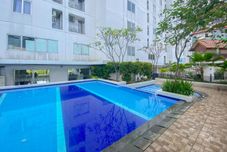 Swimming Pool Tidy and Nice 2BR at Bassura City Apartment near Mall By Travelio