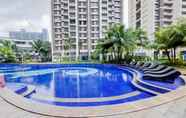Swimming Pool 6 Comfy and Big Spacious 3BR at Sky House BSD Apartment By Travelio