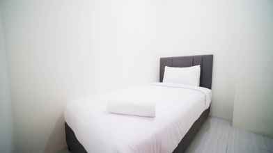 Kamar Tidur 4 Tidy and Cozy Living 2BR at Puncak Dharmahusada Apartment By Travelio