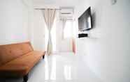 Common Space 3 Tidy and Cozy Living 2BR at Puncak Dharmahusada Apartment By Travelio