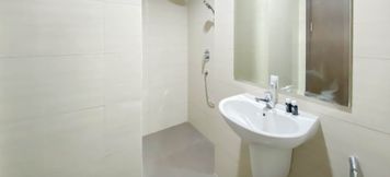 In-room Bathroom 2 Minimalist and Cozy Studio Room Ciputra International Apartment By Travelio