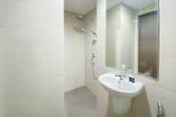 In-room Bathroom Minimalist and Cozy Studio Room Ciputra International Apartment By Travelio