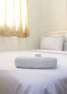 BEDROOM Simple Chic 2BR at Suites @Metro Apartment by Travelio
