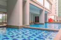 Swimming Pool Homey and Comfortable 2BR Apartment at Royal Olive Residence By Travelio