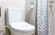 In-room Bathroom 4 Elegant and Warm 2BR at The Kensington Royal Suites Apartment By Travelio