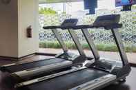 Fitness Center Elegant and Warm 2BR at The Kensington Royal Suites Apartment By Travelio