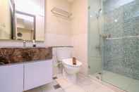 In-room Bathroom Minimalist and Homey 2BR Apartment at Nine Residence By Travelio