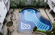 Swimming Pool 6 Tidy and Compact Studio at Puncak Dharmahusada Apartment By Travelio