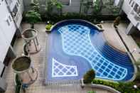 Swimming Pool Tidy and Compact Studio at Puncak Dharmahusada Apartment By Travelio