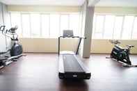 Fitness Center Tidy and Compact Studio at Puncak Dharmahusada Apartment By Travelio