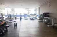 Fitness Center Well Furnished and Homey 2BR at Anderson Supermall Mansion Apartement By Travelio