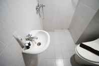 Toilet Kamar Homey and Simple 2BR at Dian Regency Apartment By Travelio