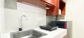 Common Space 4 Good Choice and Homey Studio at Amartha View Apartment By Travelio