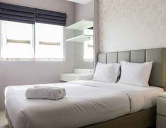 Bedroom 2 Warm and Minimalist 1BR Signature Park Grande Apartment By Travelio