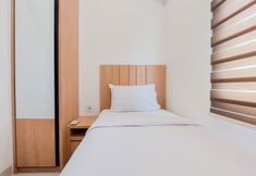 Bedroom 2 Warm and Simply Look 2BR at Serpong Garden Apartment By Travelio