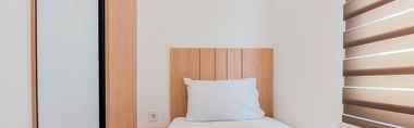 Bedroom 2 Warm and Simply Look 2BR at Serpong Garden Apartment By Travelio