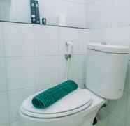 In-room Bathroom 4 Simply and Comfort 2BR at Green Pramuka City Apartment By Travelio