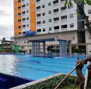 Swimming Pool 5 Simply and Comfort 2BR at Green Pramuka City Apartment By Travelio