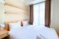 Bedroom Homey and Cozy Stay 1BR Vasanta Innopark Apartment By Travelio