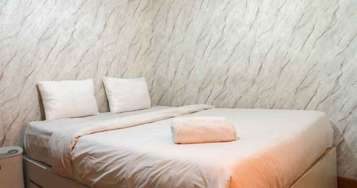 Bedroom Homey and Warm 2BR at Sentraland Cengkareng Apartment By Travelio