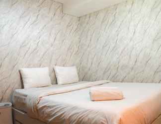 Bedroom 2 Homey and Warm 2BR at Sentraland Cengkareng Apartment By Travelio