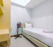 Bedroom 2 Cozy Living 2BR at Royal Heights Apartment By Travelio