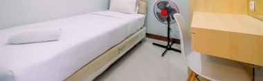 Bedroom 2 Cozy and Comfort 2BR Royal Heights Apartment By Travelio