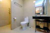 In-room Bathroom Strategic and Good Deal 1BR L'Avenue Apartment By Travelio