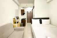 Bedroom Homey and Good Choice Studio Transpark Cibubur Apartment By Travelio