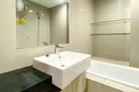 In-room Bathroom Comfy and Spacious Studio Room Azalea Suites Apartment By Travelio