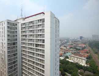 Exterior 2 Warm and Homey Studio Room at Taman Melati Margonda Apartment By Travelio