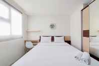 Bedroom Homey Studio Room at Bintaro Icon Apartment By Travelio